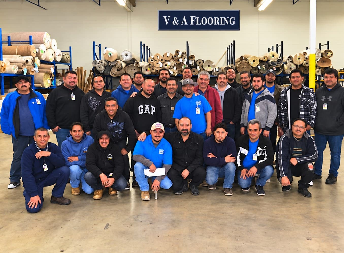 V & A Flooring Inc installers and staff in the company warehouse in Sun Valley